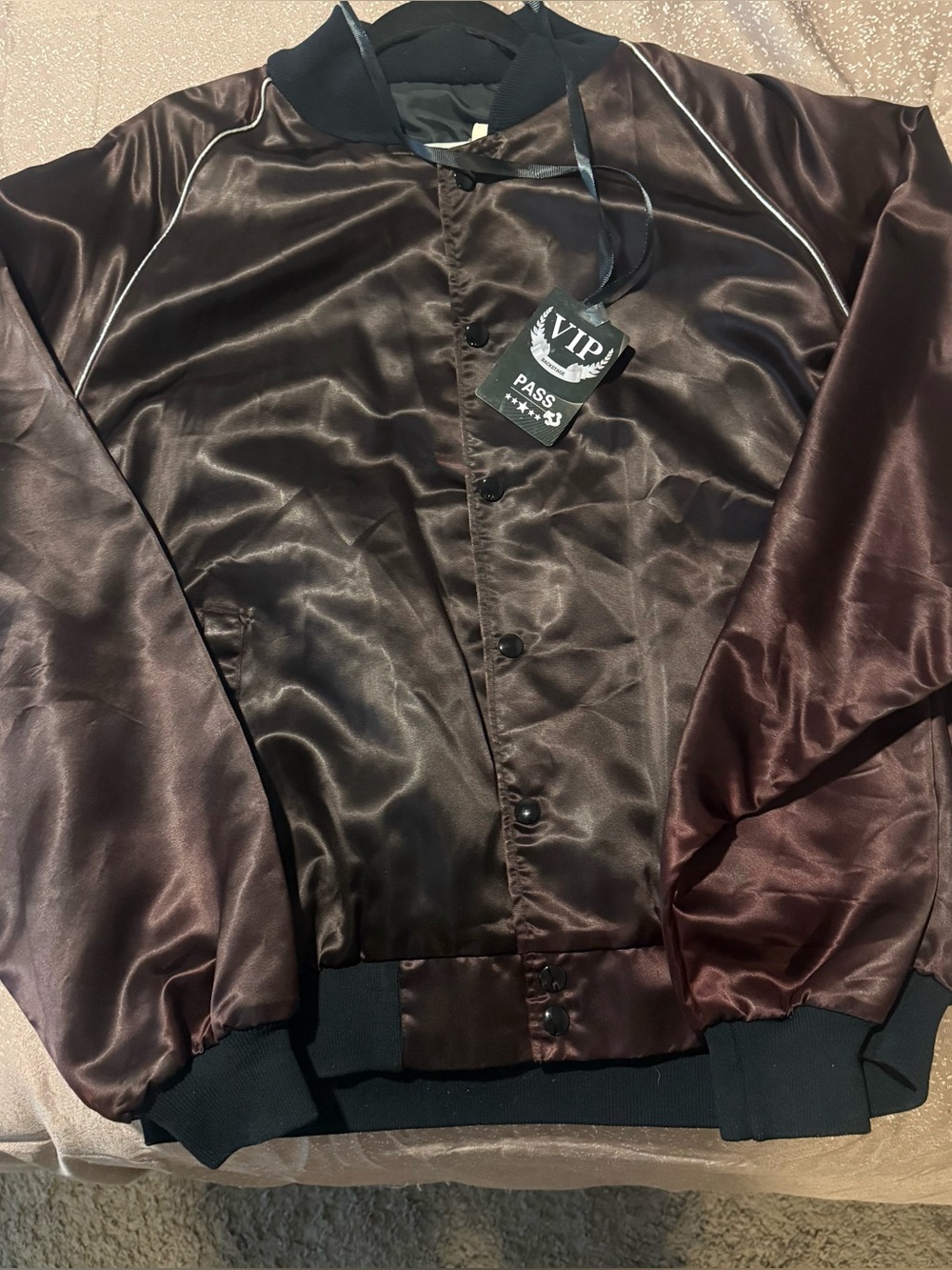 The Jackson’s Victory Tour Satin Jacket, snap button front.